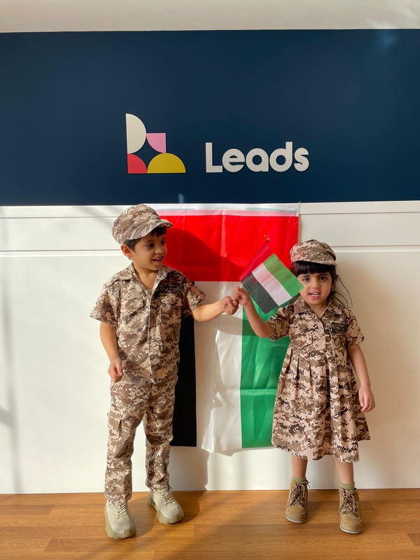 Leads Early National Day Celebration